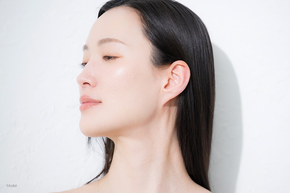 Profile of a young asian woman
